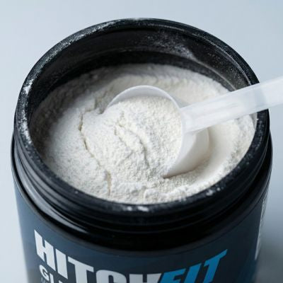 Close-up of pure unflavored L-glutamine powder showing clean texture and fine granules